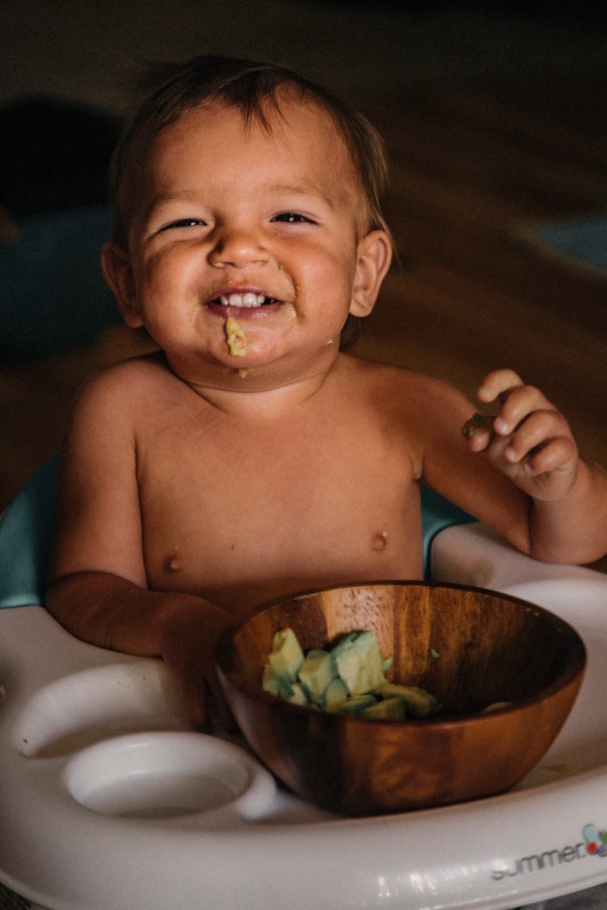 baby eating avocado