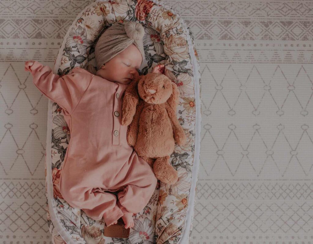 Organice baby nest with baby inside sleeping