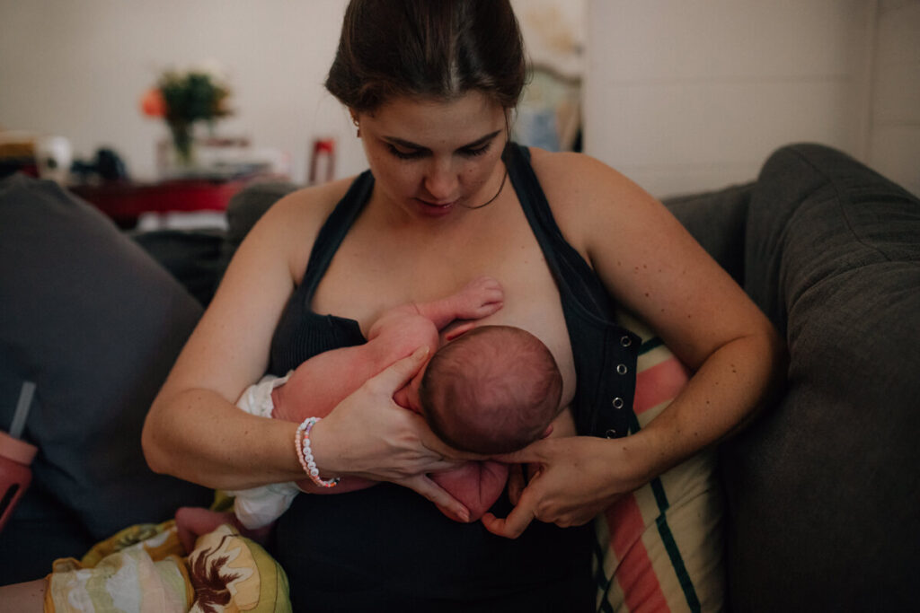 woman breastfeeding in cradle position