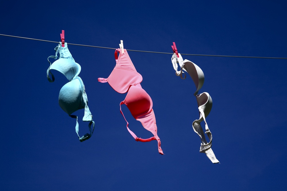 bras hanging on the line
