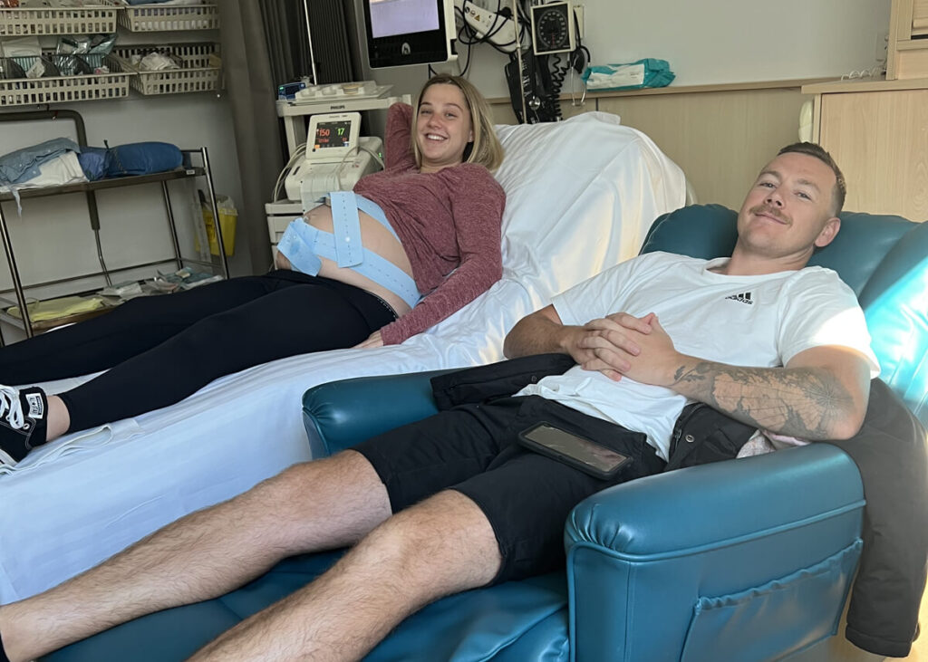 couple on hospital bed and chair