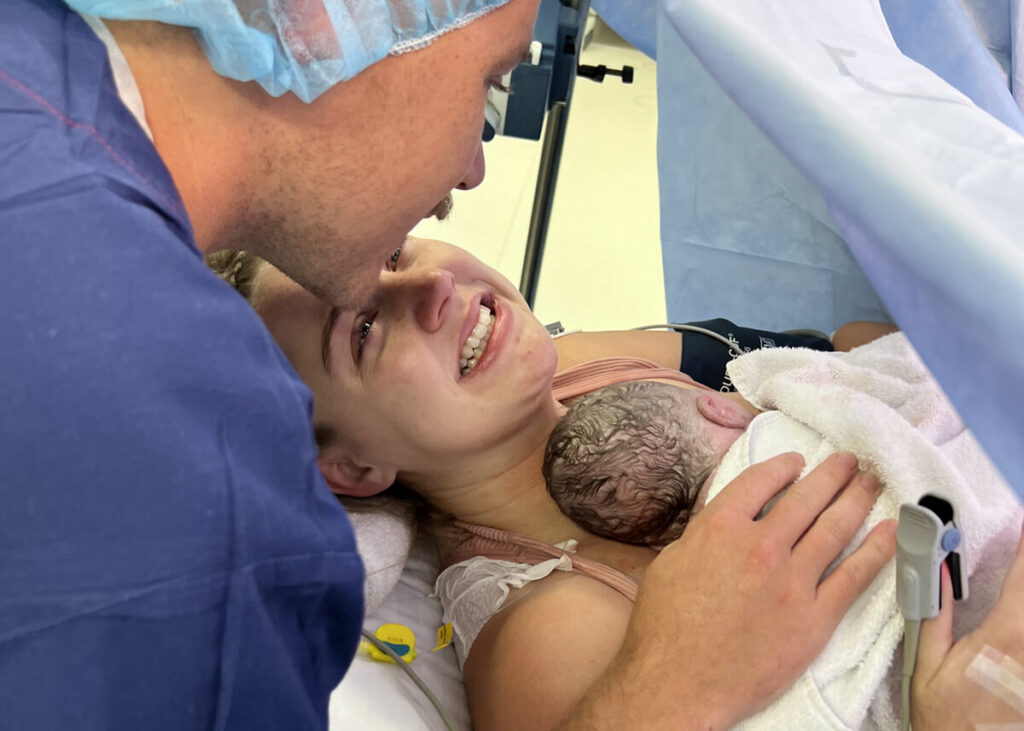 couple with their newborn baby