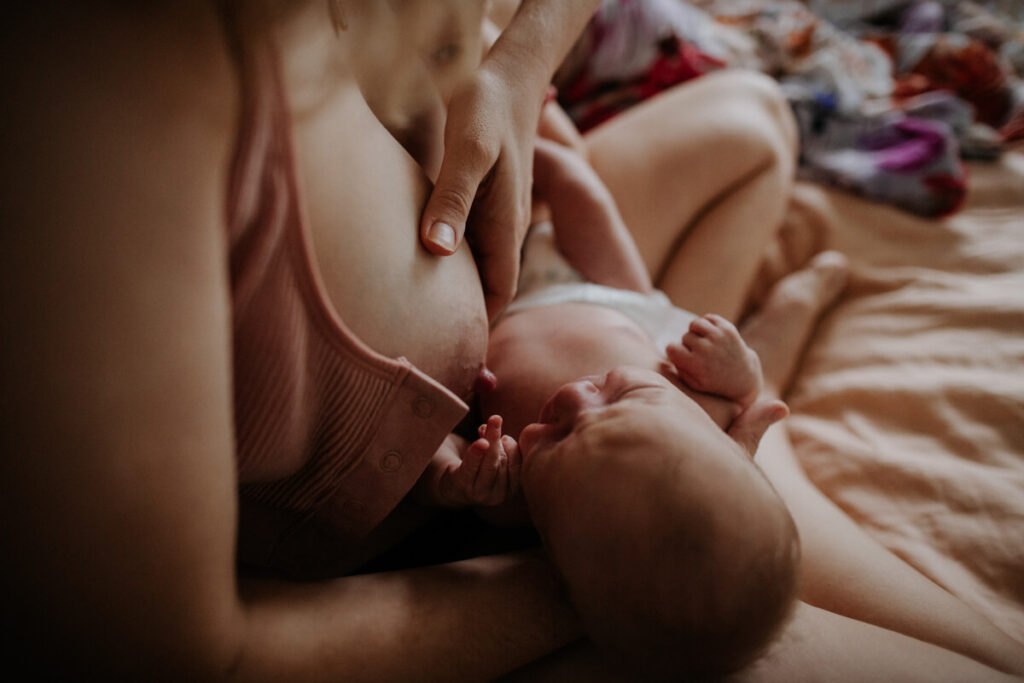 woman breastfeeding her baby - close up