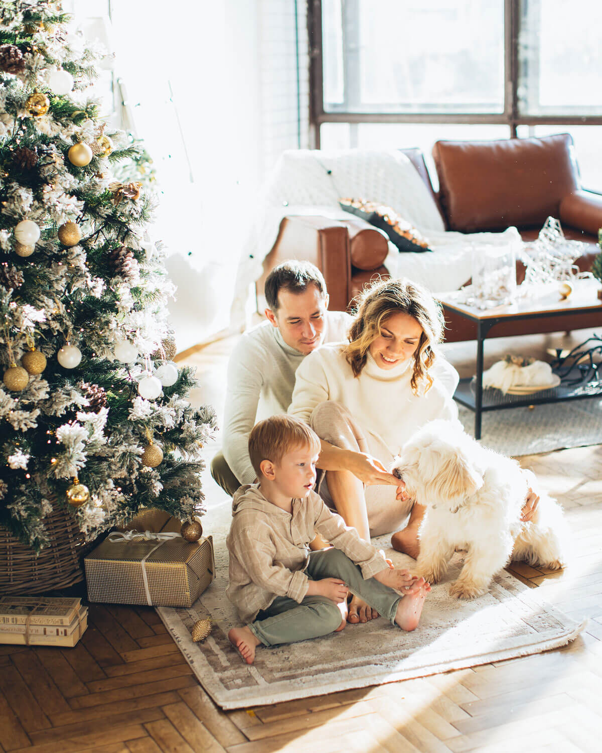 family in front of christmas tree