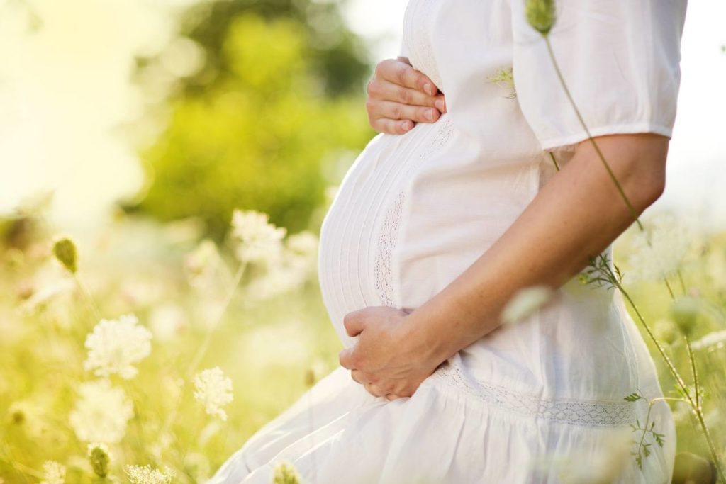 pregnant woman in white