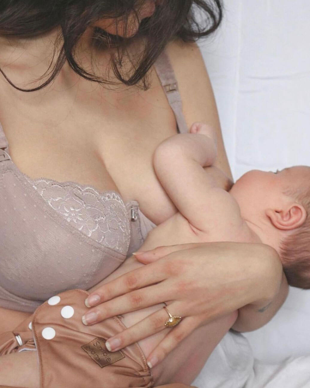 breastfeeding mom wearing timtams nursing bra