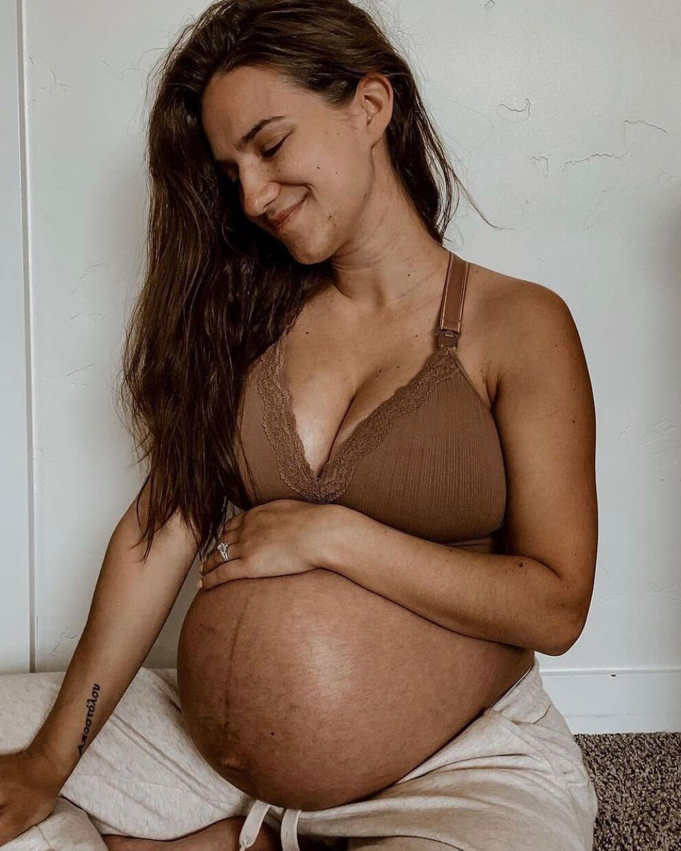pregnant woman wearing a nursing bra