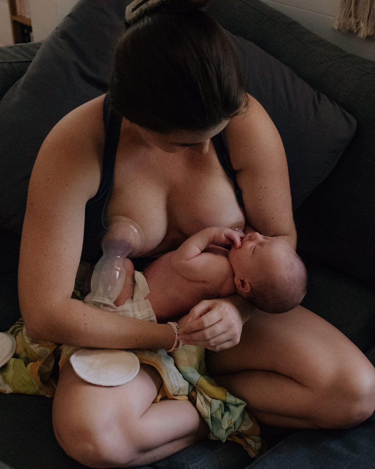 woman breastfeeding and pumping