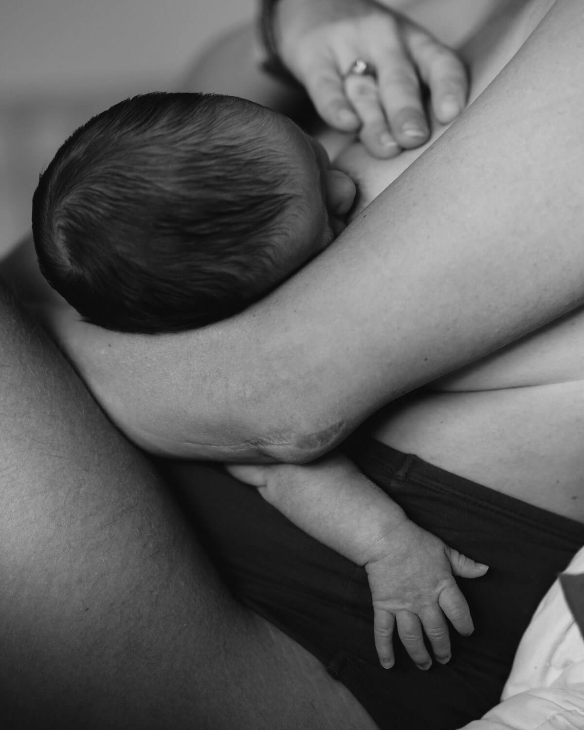 woman breastfeeding - black and white
