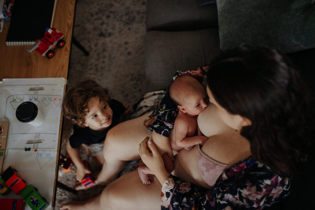 woman breastfeeding baby