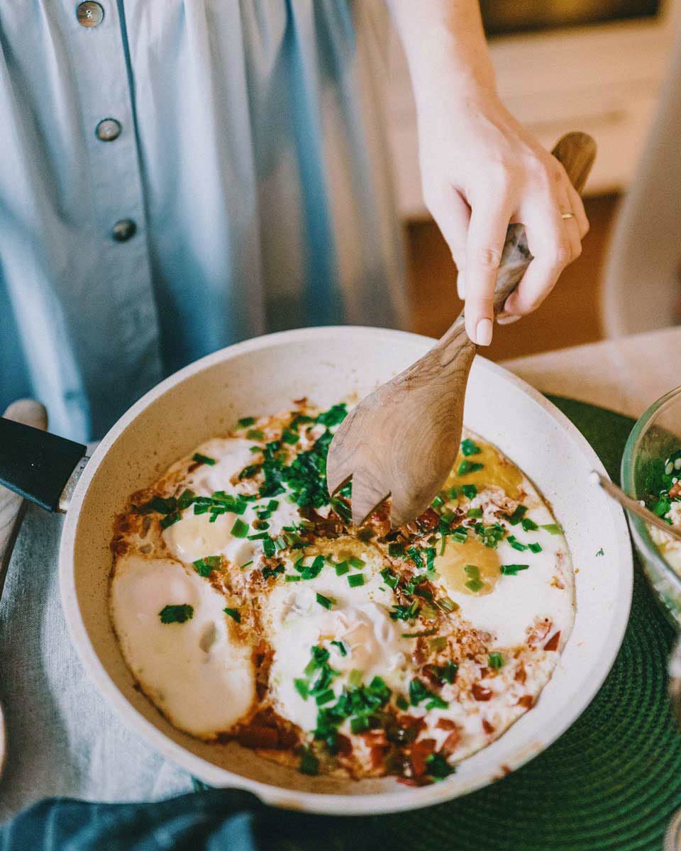 woman cooking in a pan