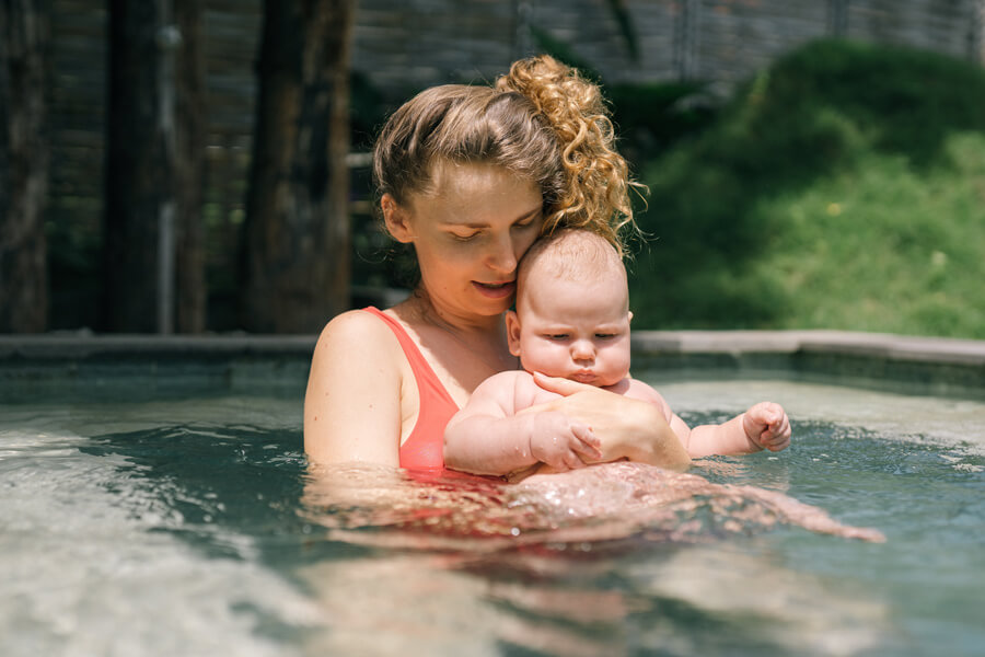 mama and baby in the pool