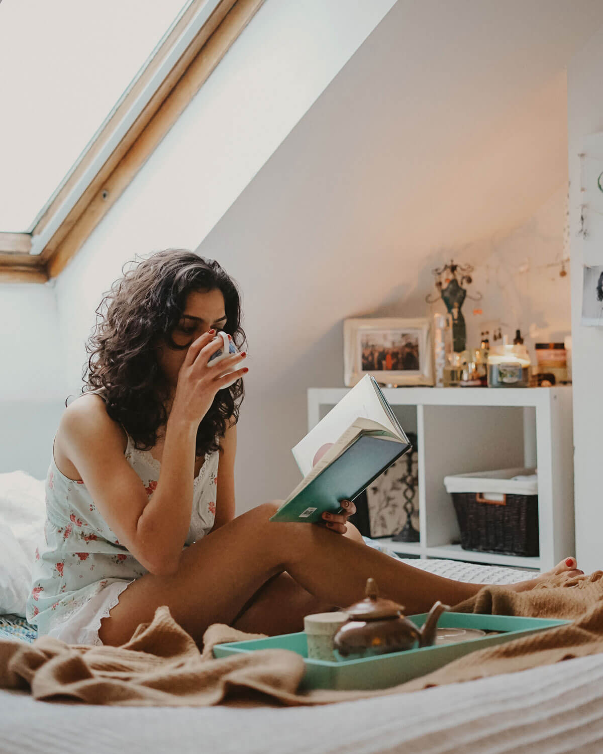woman in bed reading